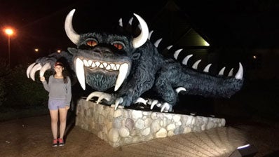 Lauren Haggerty, COHS student, standing in front of statue in Wisconsin for her internship.