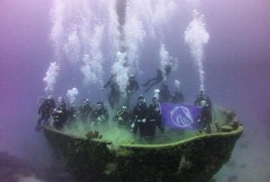 Divers in giant clam shell