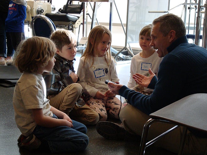 Dr. Shawn Simonson talks with kindergartners about why it is important to take care of your body. 