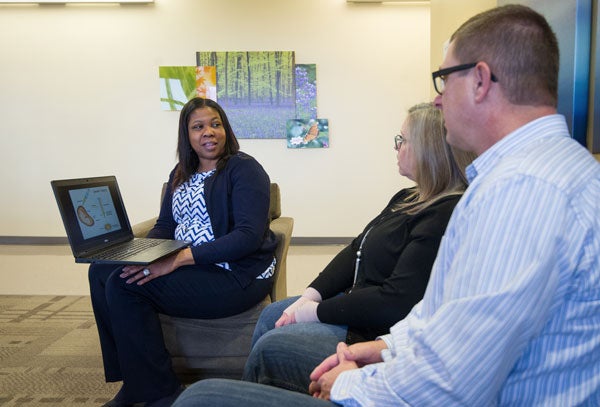 Couple talking with a genetic counselor