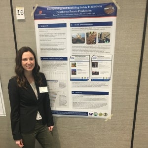 Rachel Phinney next to her research poster