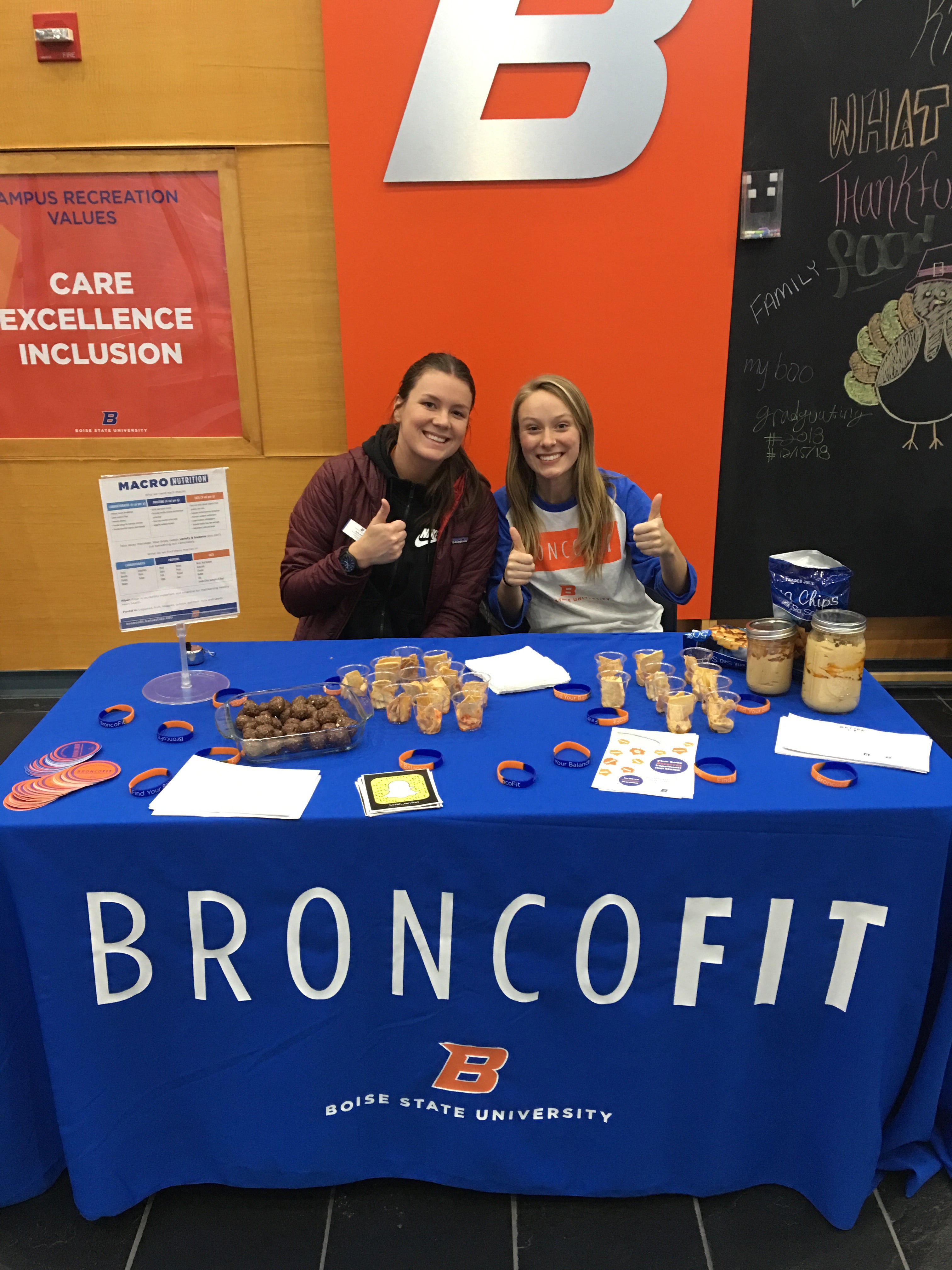 Bronco Fit Peer educators sitting at a table 