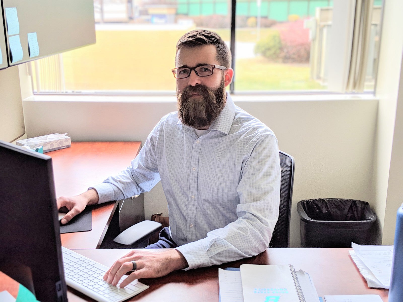 Luke Montrose sitting at his desk