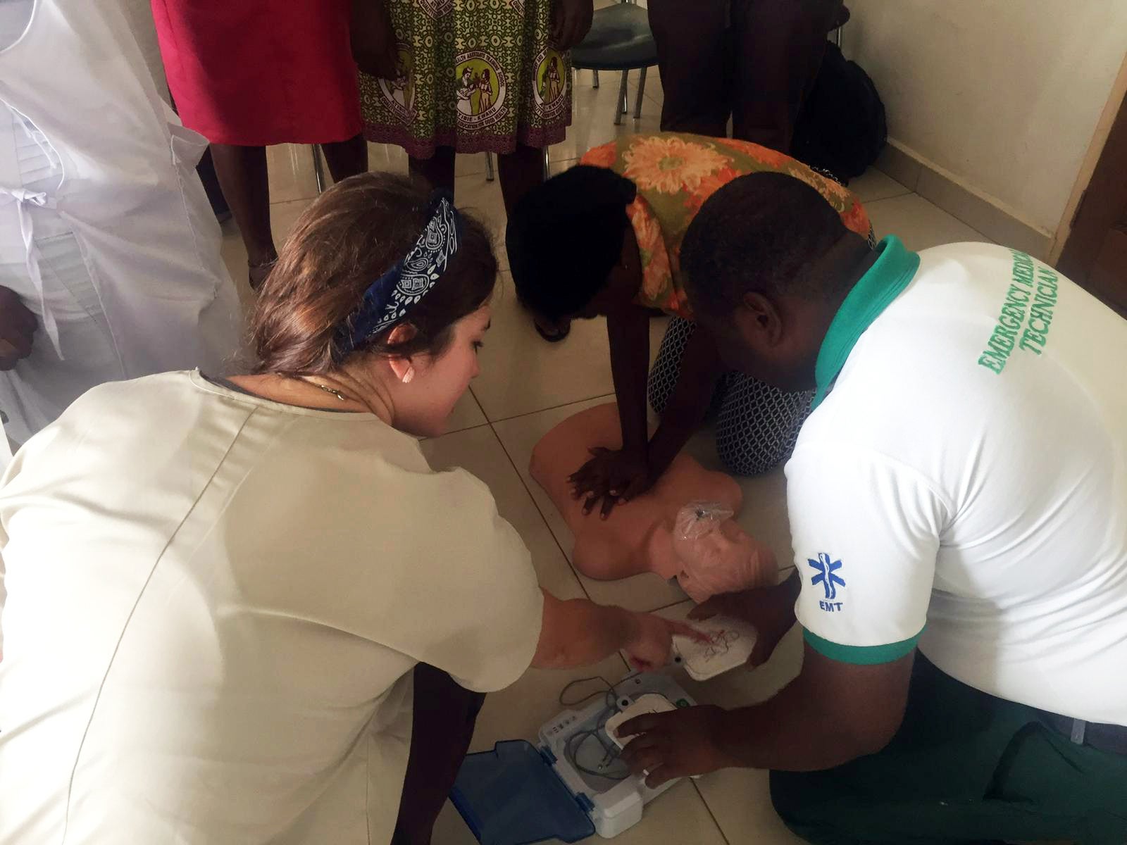 Abbey teaching people in Ghana how to perform CPR 