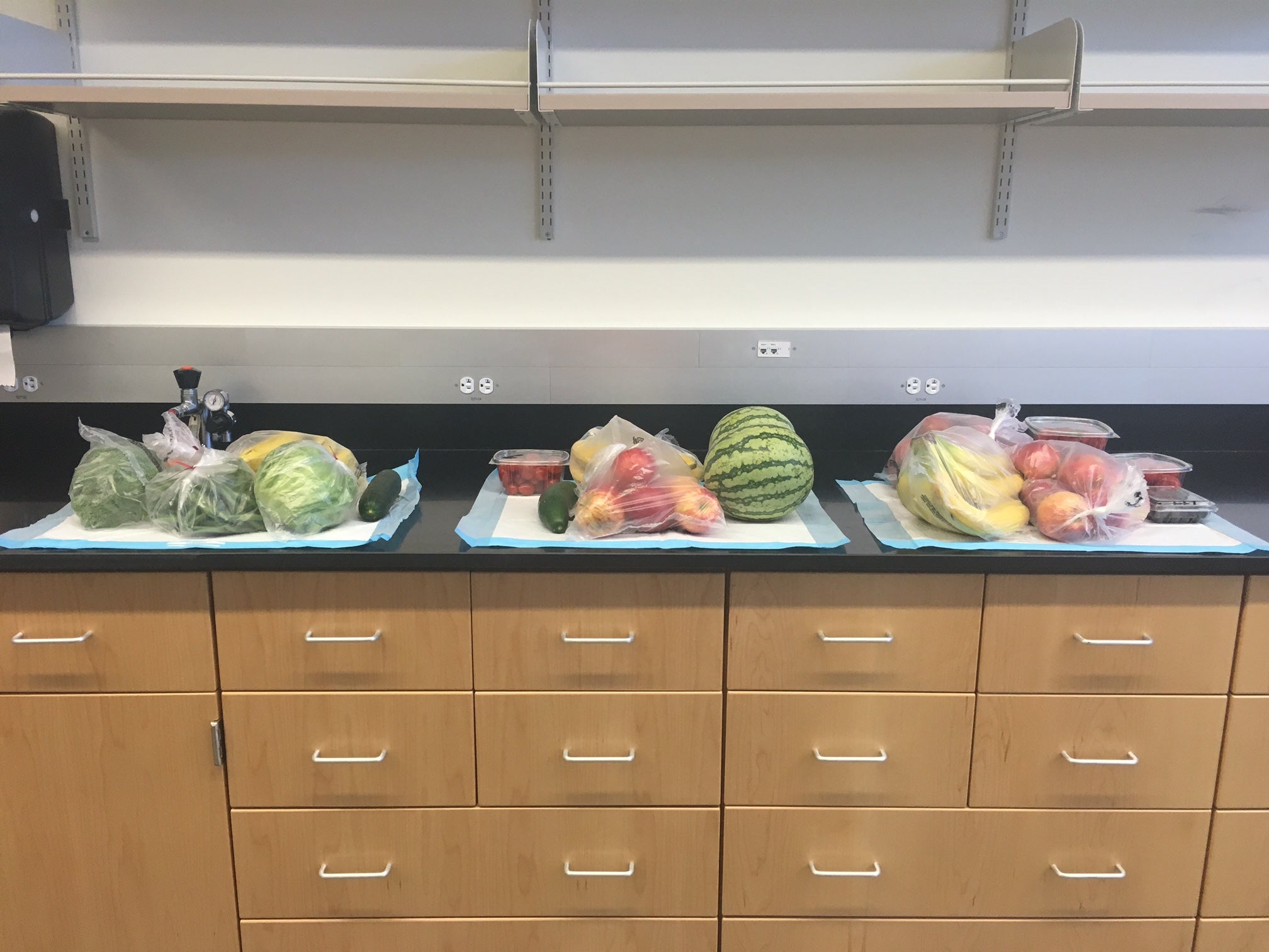 Photo of a counter with fruits and vegetables on it