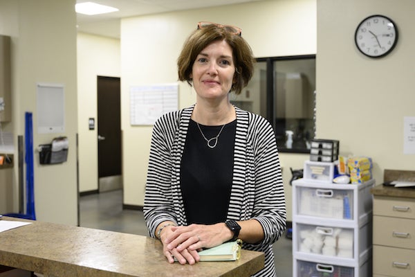 Nicole Lang standing at desk