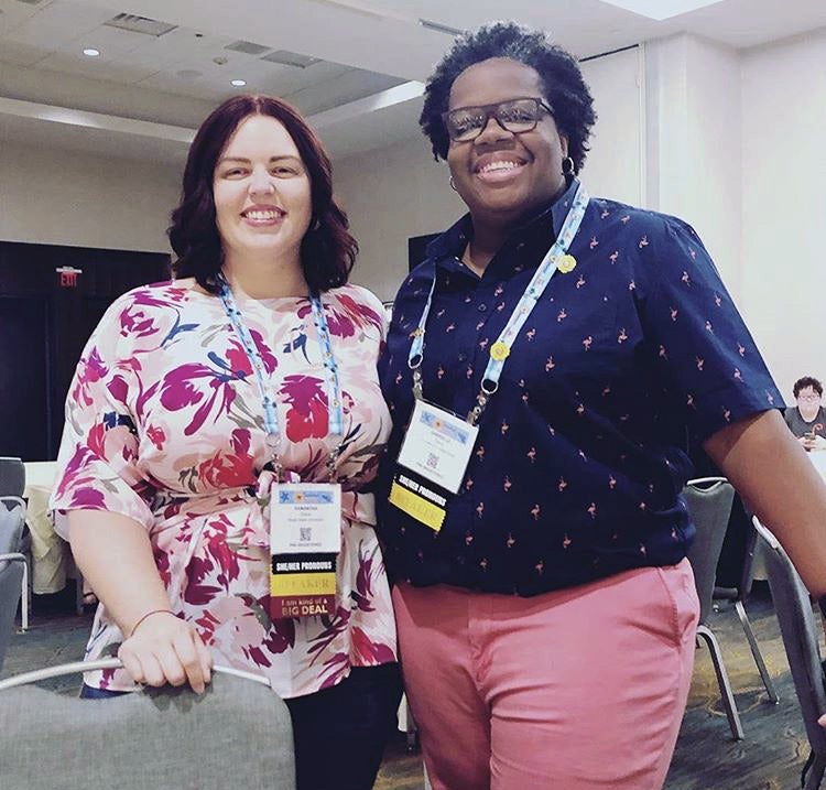 Two people attending a health conference