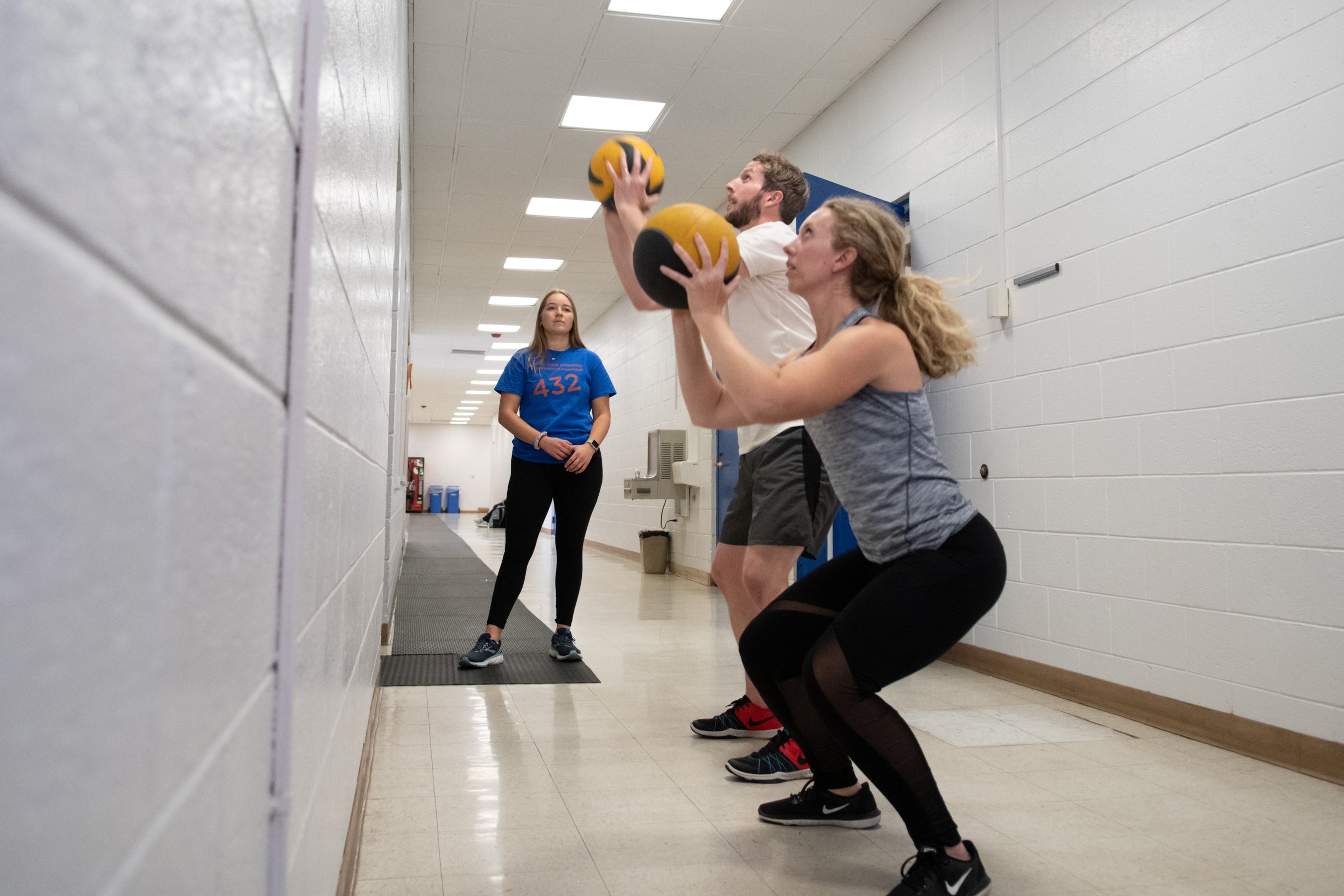 KINES 432 Conditioning Principles students provide personal training to faculty and staff as part of the kinesiology Fitness Challenge, Kinesiology Annex, photo Patrick Sweeney