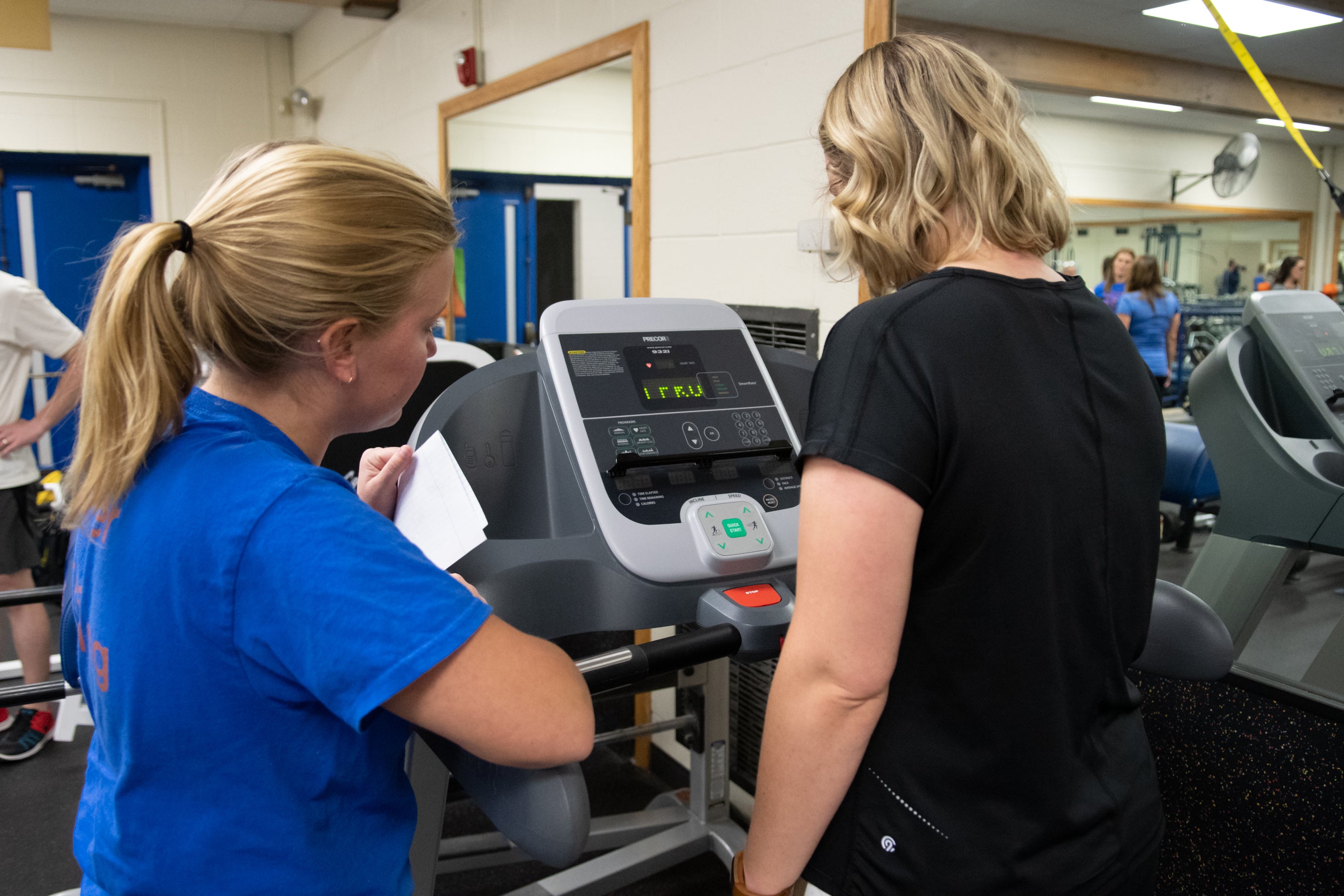 KINES 432 Conditioning Principles students provide personal training to faculty and staff as part of the kinesiology Fitness Challenge, Kinesiology Annex, photo Patrick Sweeney