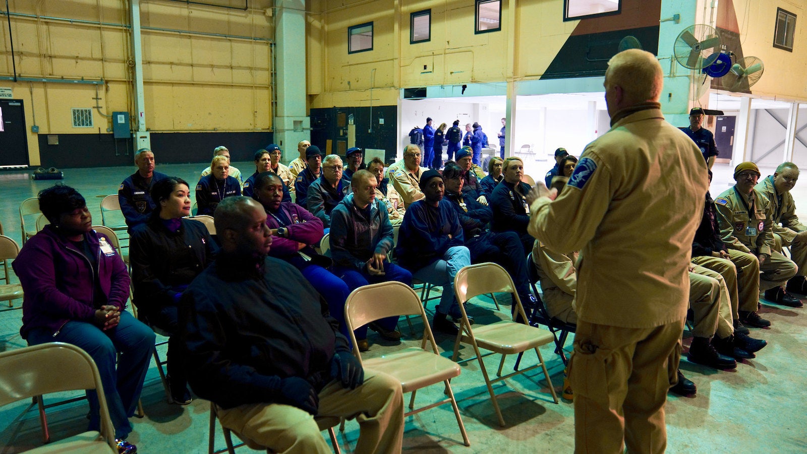 Evacuees from Wuhan, China, were evaluated for symptoms of COVID-19 at Travis Air Force Base by responders from the National Disaster Medical System (NDMS). Photo by U.S. Department of Health and Human Services.