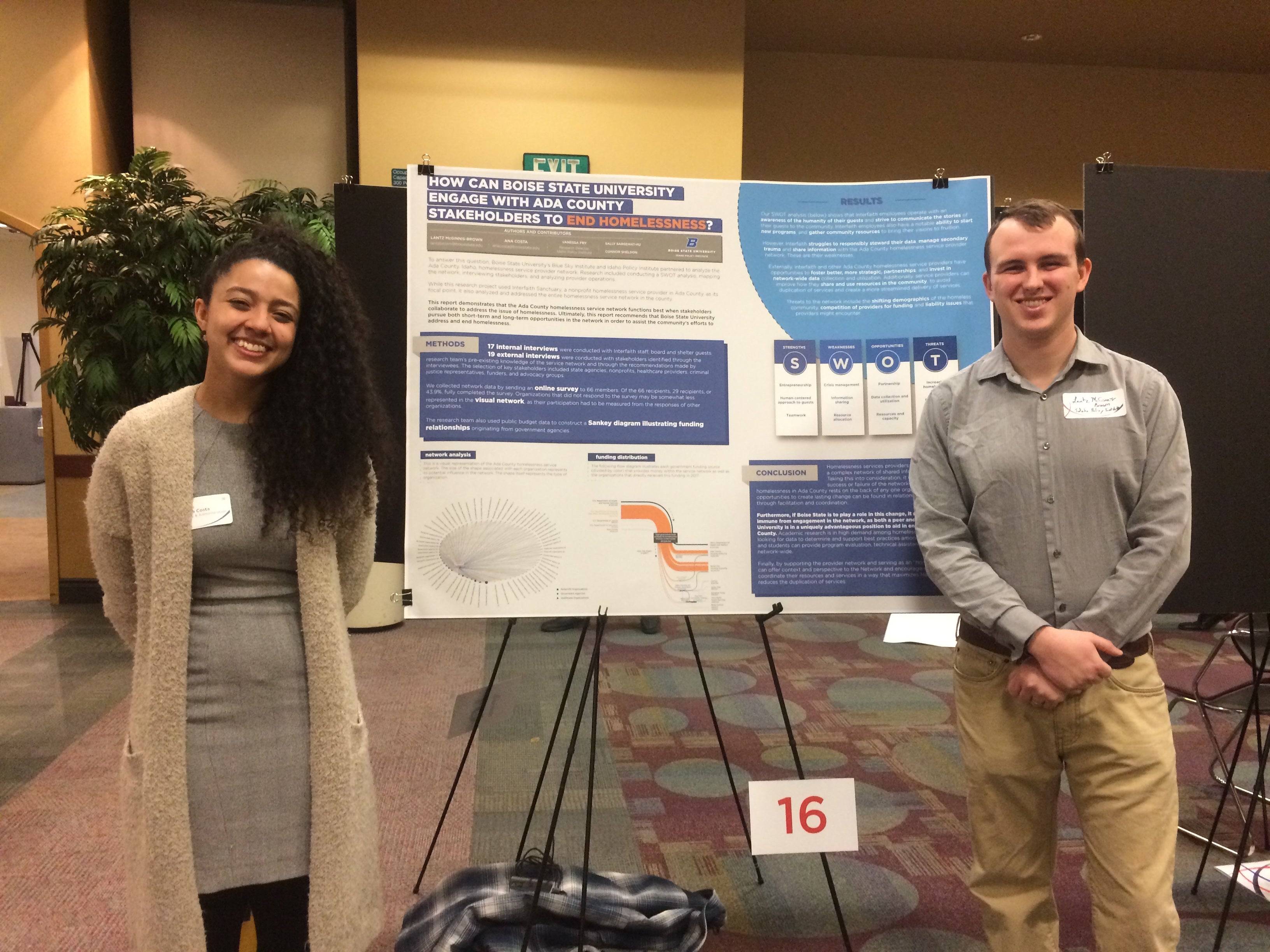 Ana and Lantz in front of research poster