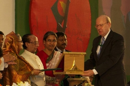Photo of Bangladeshis presenting award to Garry Wenske.  Bangladesh Prime Minister Sheikh Hasina, President Zillar Rahman, and Foreign Minister Dipu Mon
