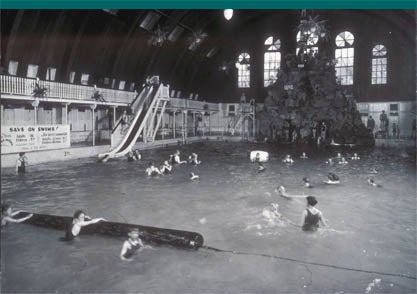 Swimmers of all ages come to frolic in the natural warm water of the Natatorium's pool.
