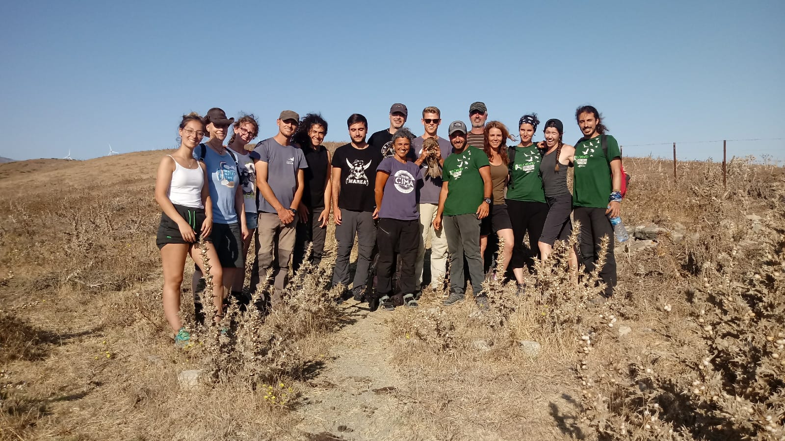 a group of scientists stand together for a photo