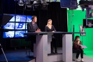 Two student broadcast on camera
