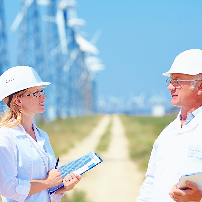 Meeting in front of wind turbines