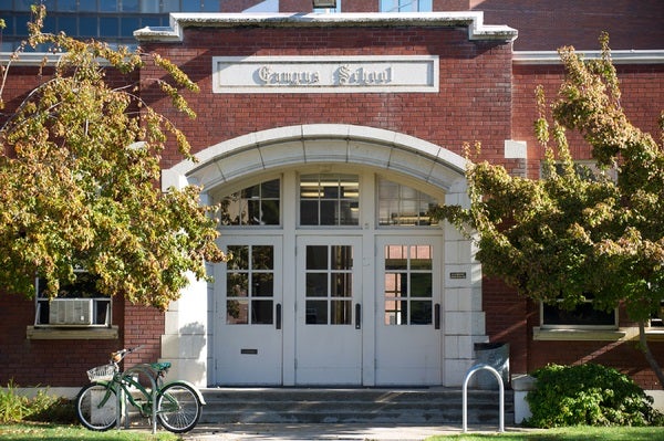 Photo of the White Arched Doorways of the Campus School Building