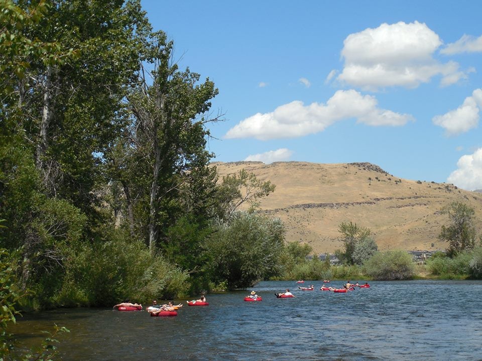People float in tubes down the Boise River