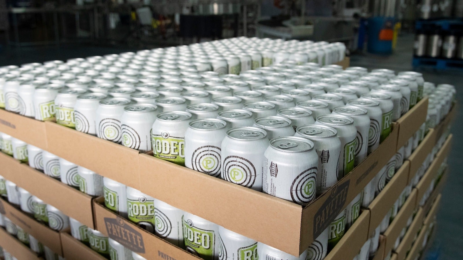 Cases of beer bottled into cans, stacked on a pallet