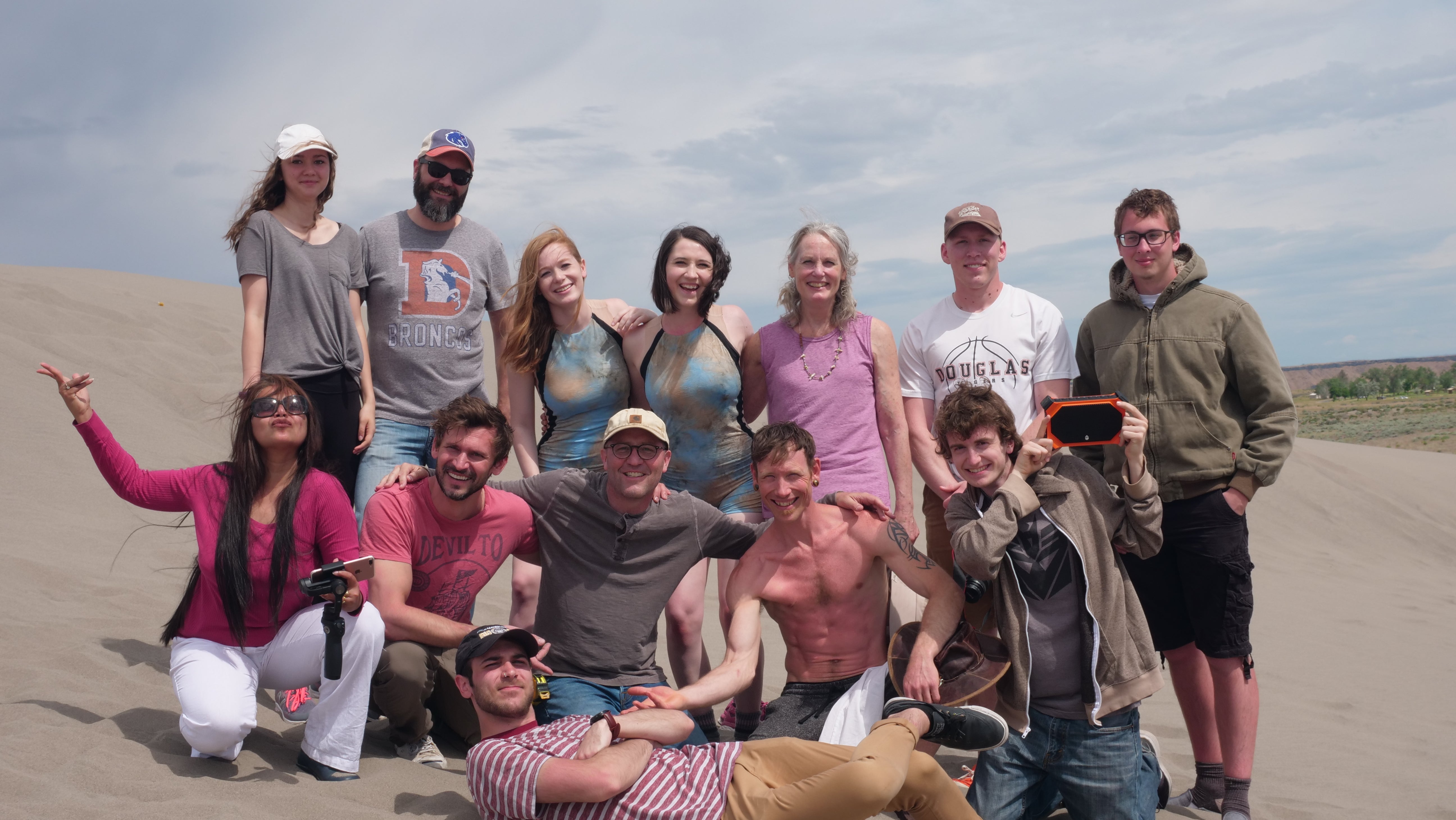 a group photo of dancers at Bruneau Dunes, filming on-site. 