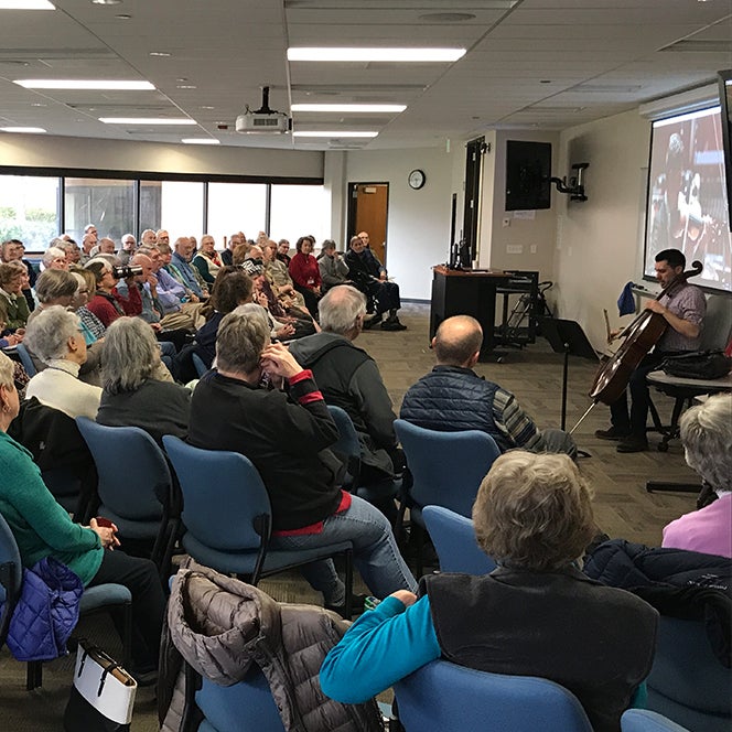 Brian Hodges plays the cello for Osher crowd