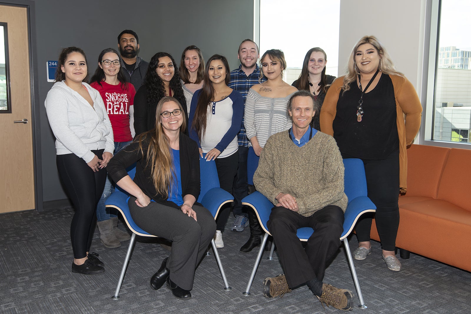 Cathy Olschanowsky and Keith Barnes and students behind them