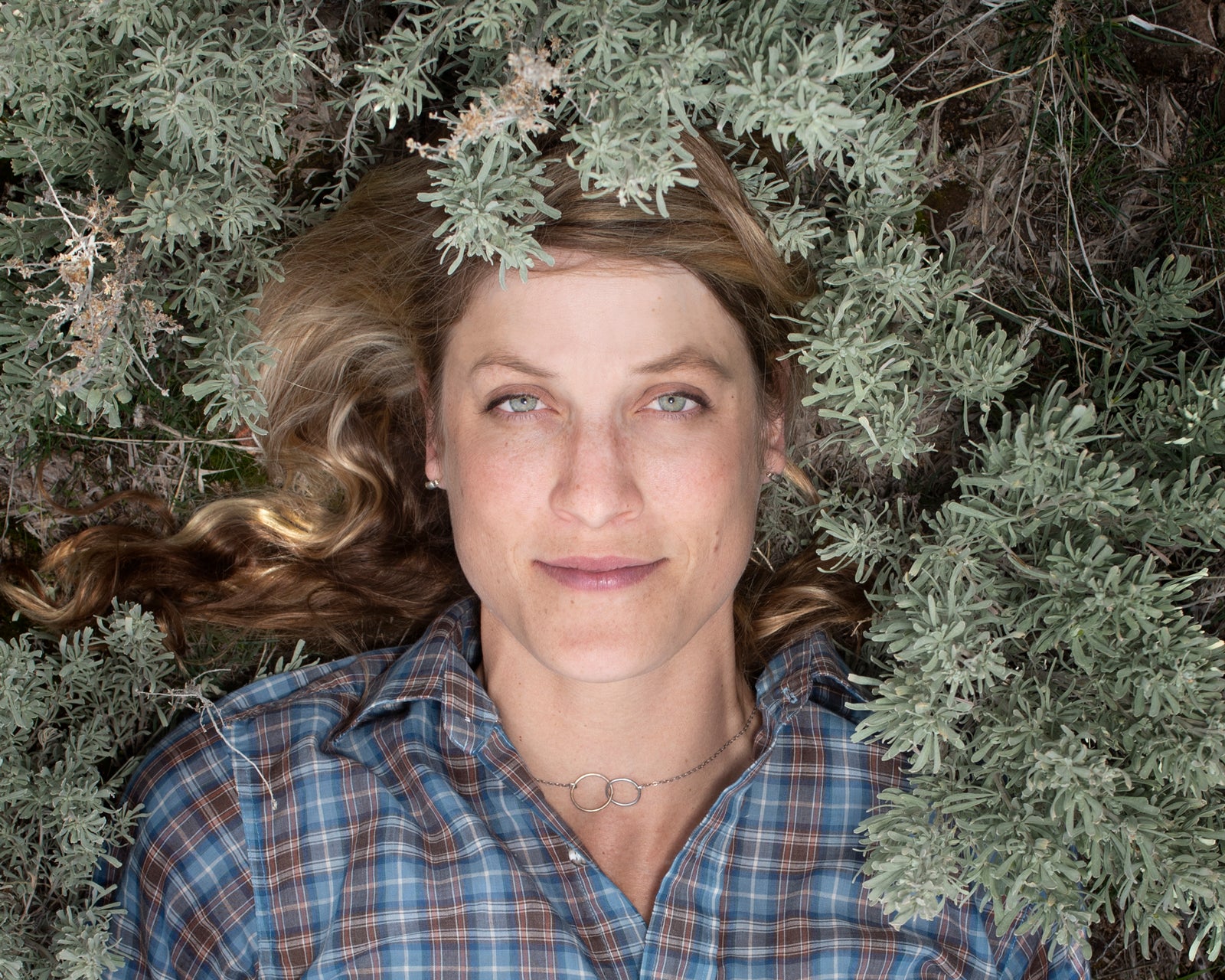 Martha Brabec portrait surrounded by sagebrush