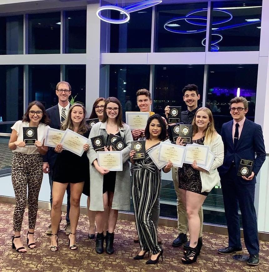 Arbiter staff holding their awards