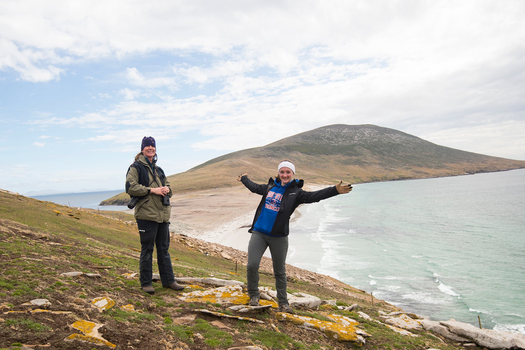 Biology students Gretel Care and Lauren Young, standing on Saunders Island,