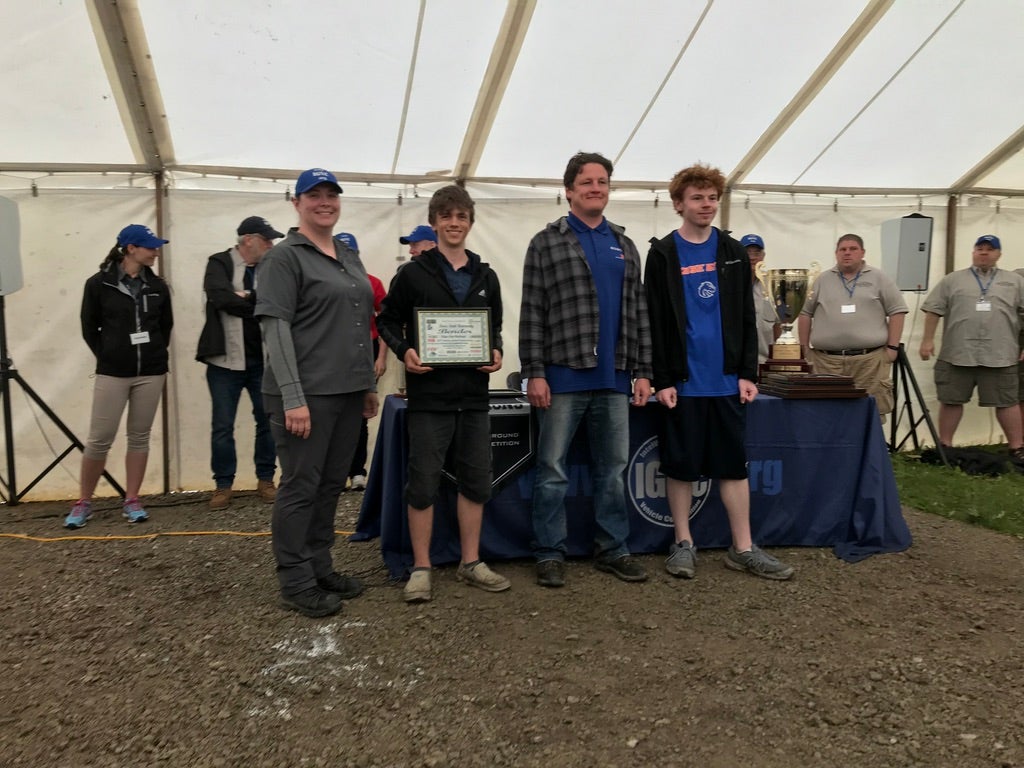 Team members with certificate for first place