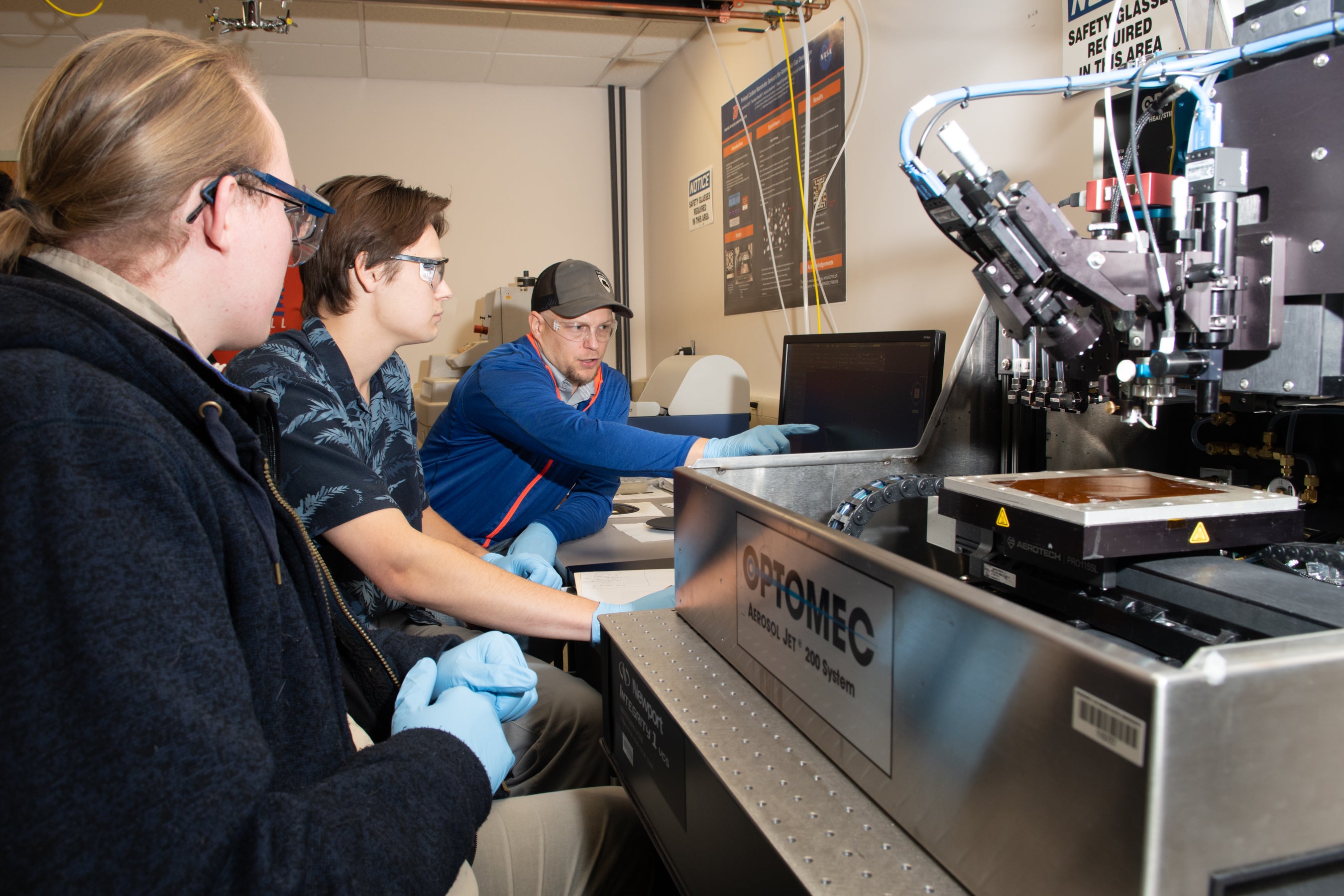 students by large plastic shielded printer