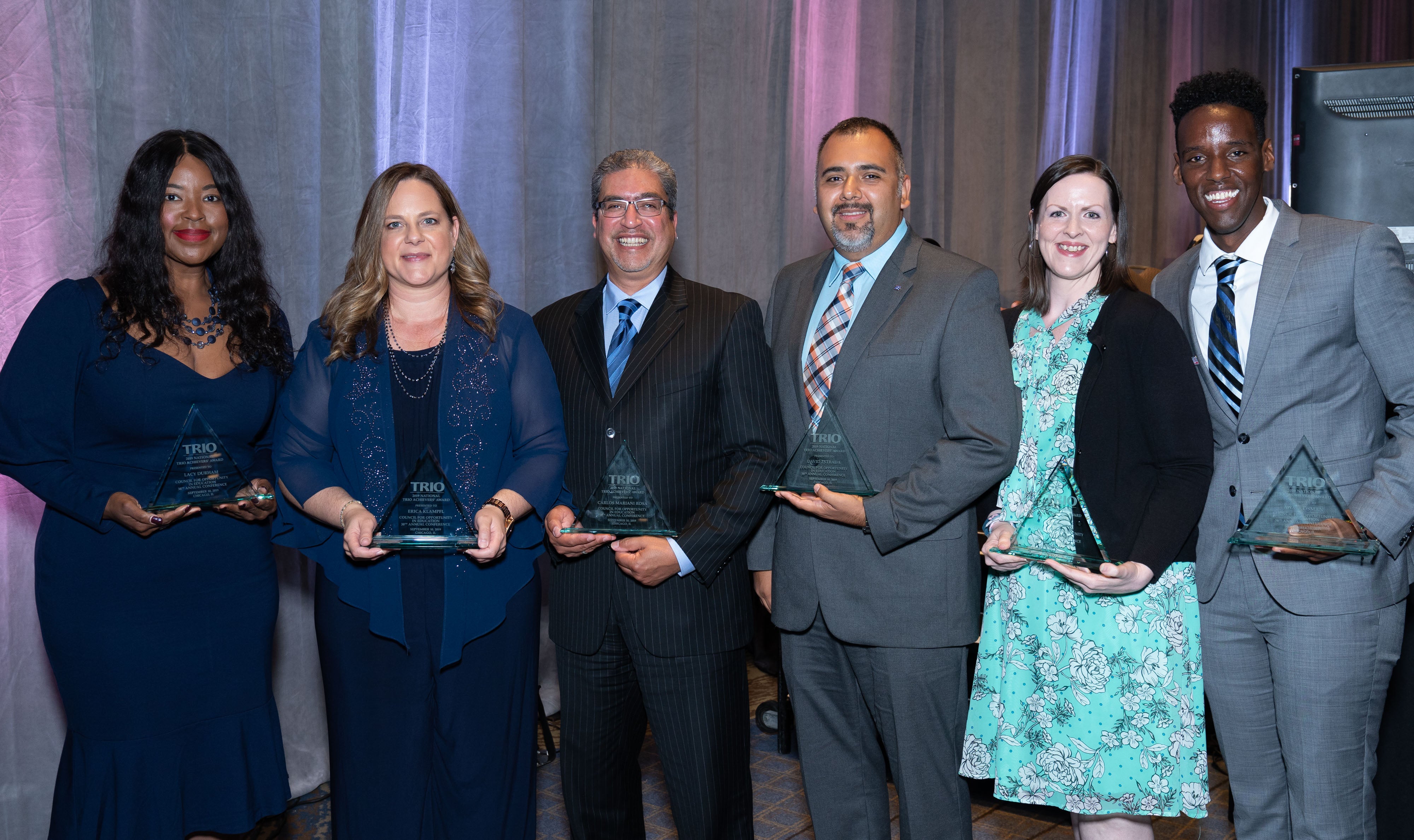 Award winners stand in line with awards