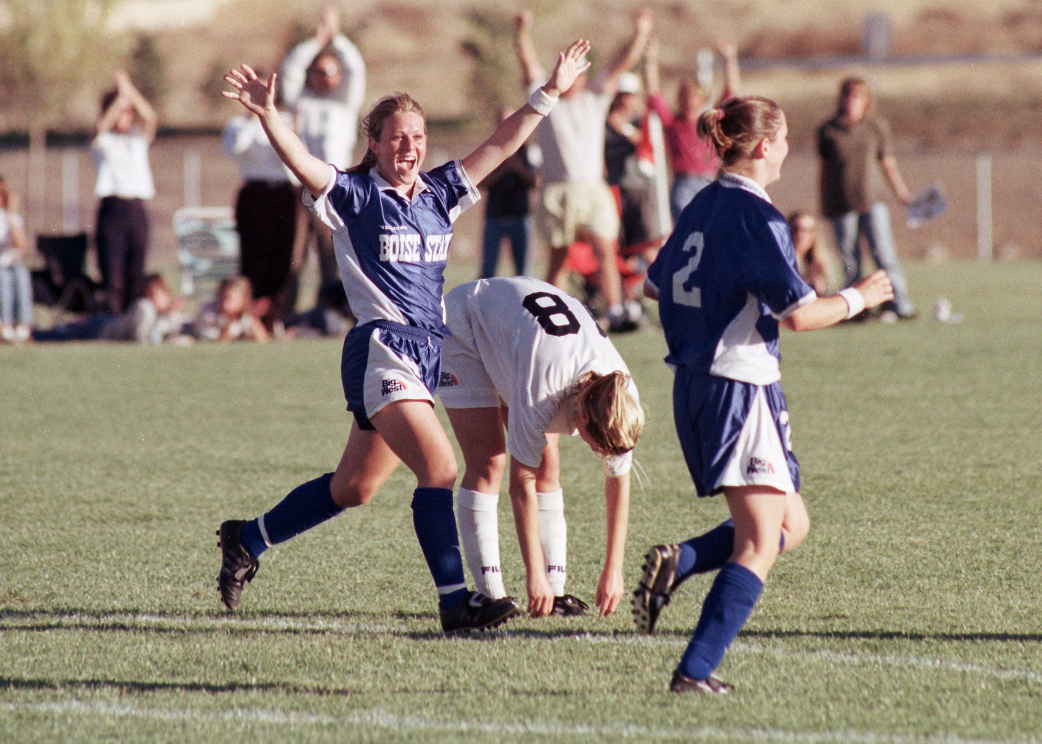 Soccer players celebrating on the field