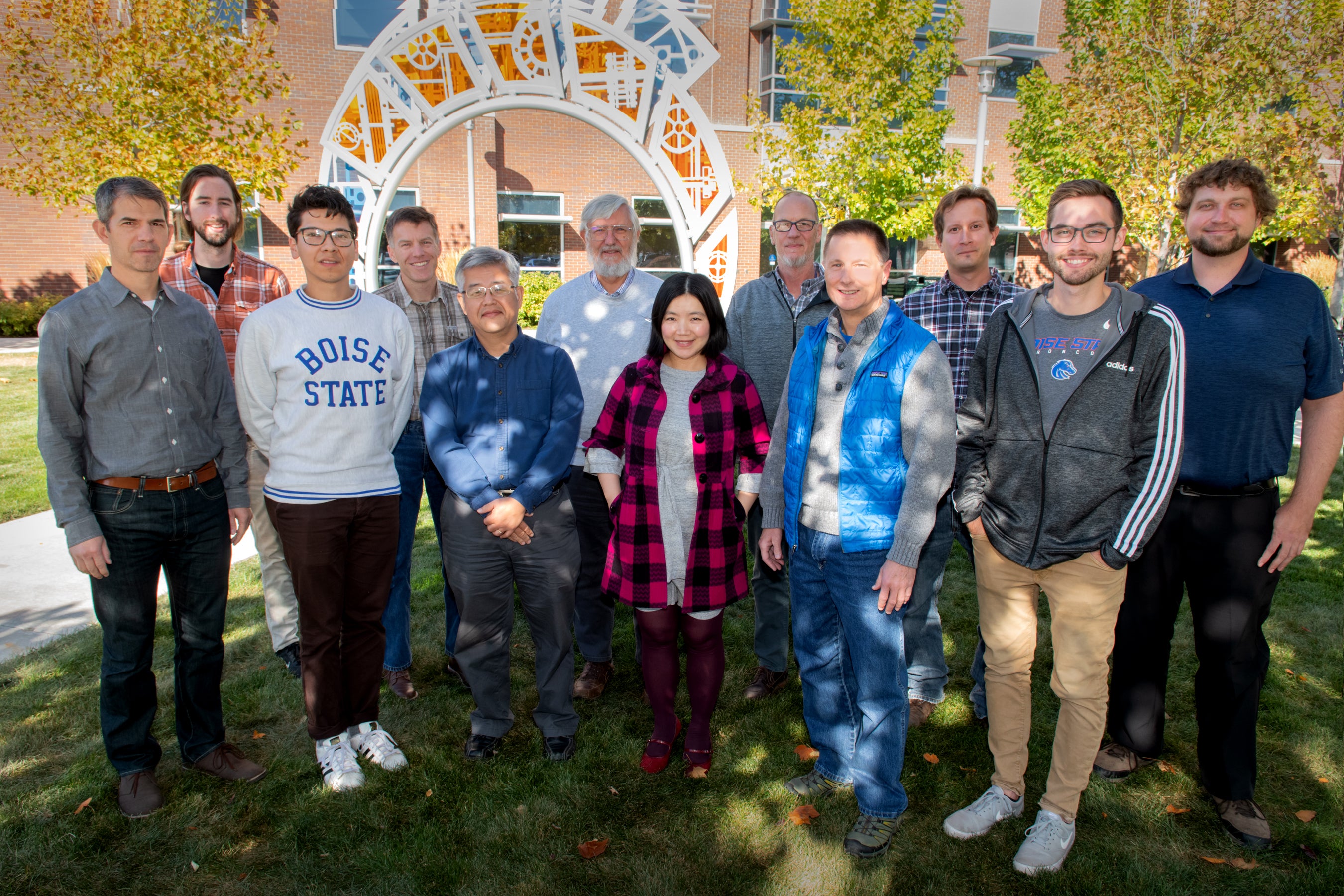 Team of researchers pose for outside portrait