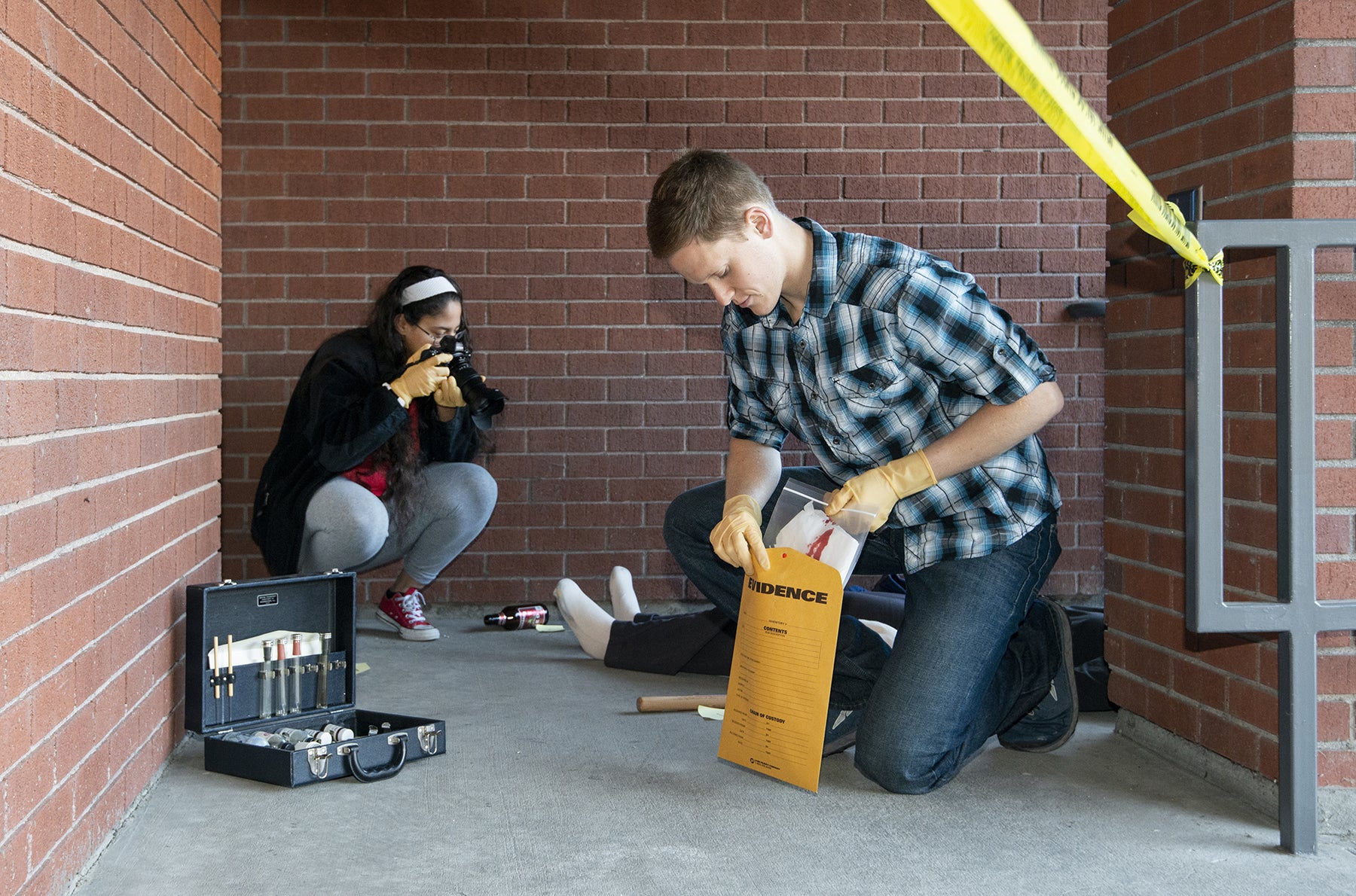 Two students stage a crime scene