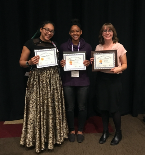 Three students show off their awards