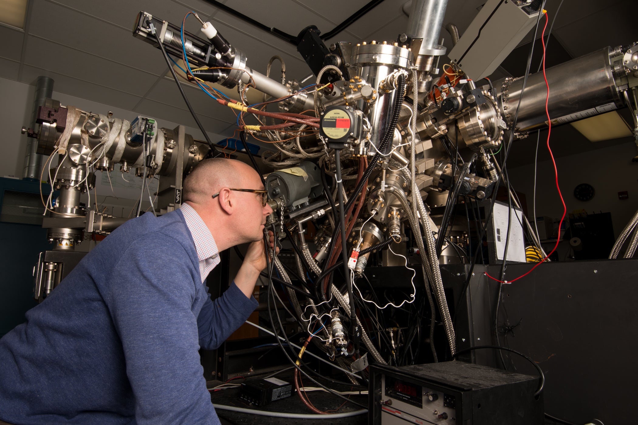 Simmonds looking closely at Molecular Beam Epitaxy device