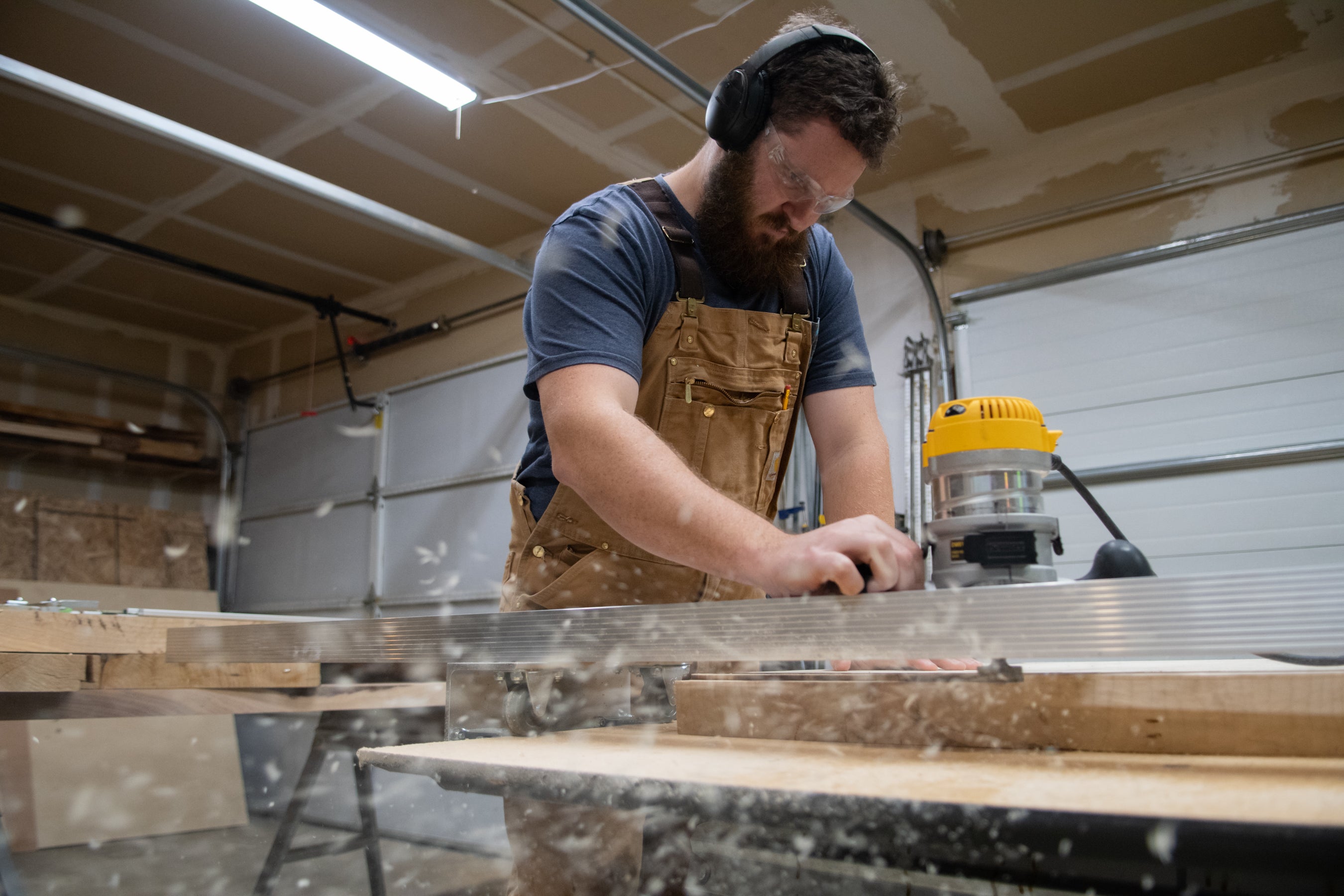 Alex sanding wood in his shop