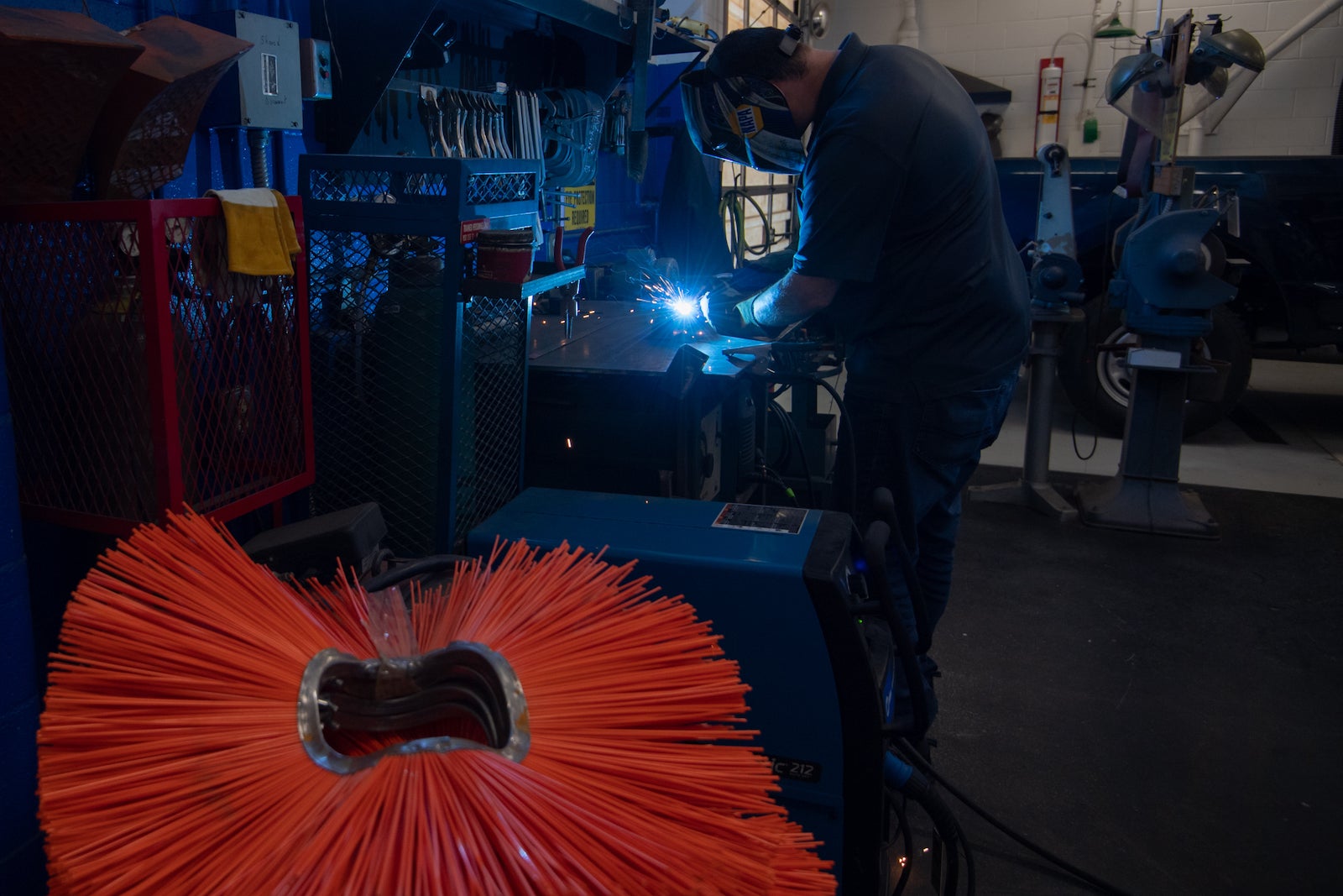 Man welding in an auto shop