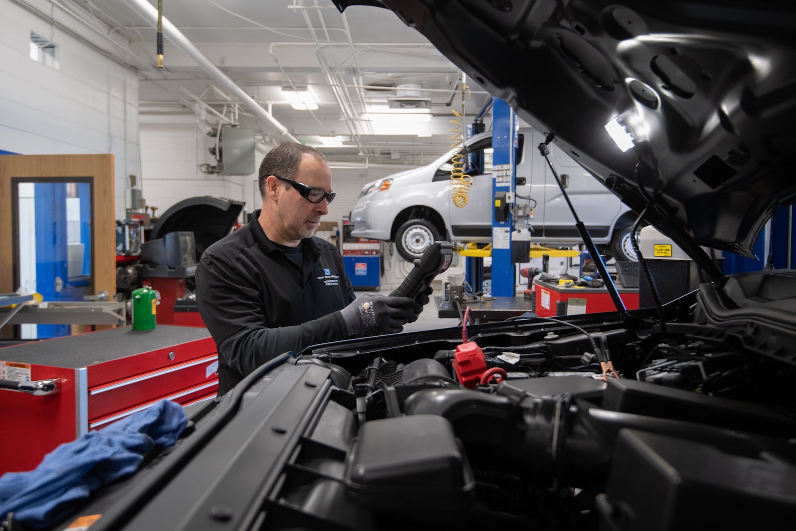 Man working on a truck engine