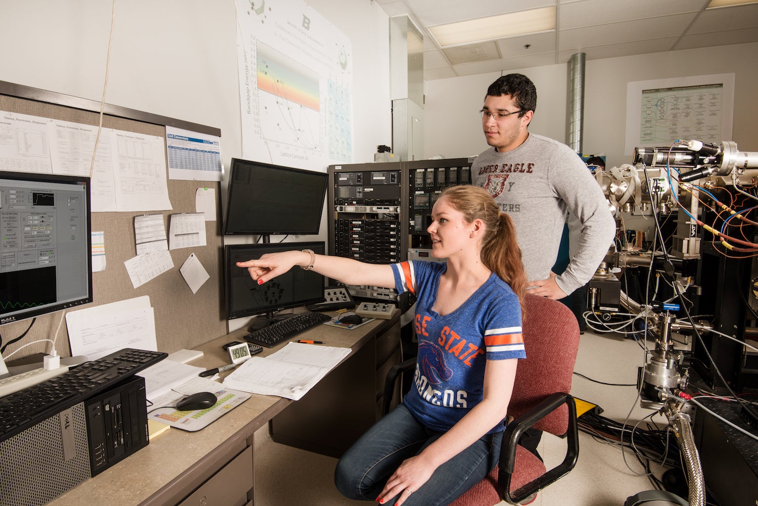 Two students look at computer screen