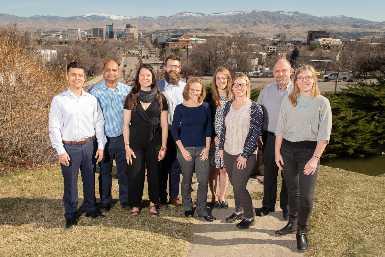 Group of people standing outside overlooking campus