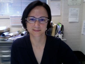 Self-portrait of Karen Viskupic at her desk.