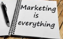 Notepad with Marketing is Everything written on it.