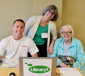 Boise State student, Professor Kathy Hurley and a tax return client