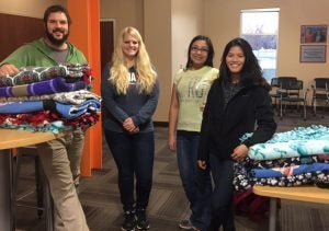 BetaGammaSigma students with blankets donations