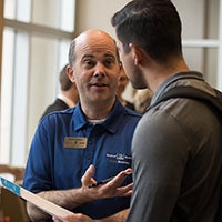 Textron Aviation rep. talking to student