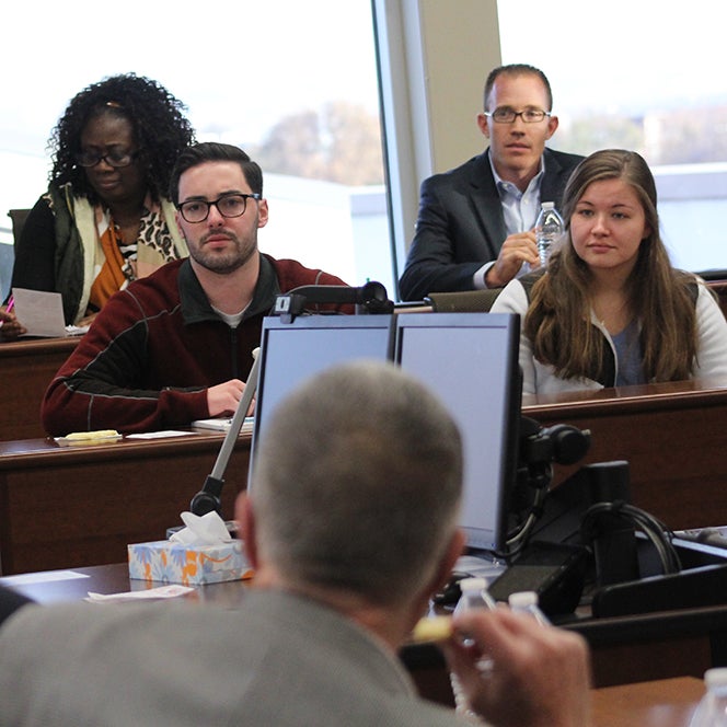 faculty and students engaged with Ward Parkinson, co-founder of Micron