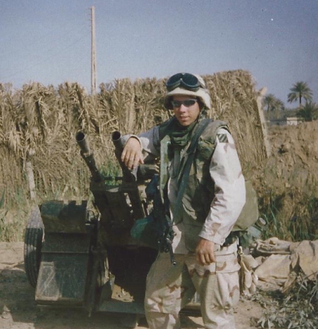 Author in uniform posing with artillery
