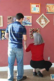 students hanging children's art